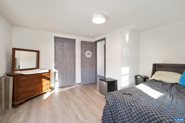 bedroom with light hardwood / wood-style floors