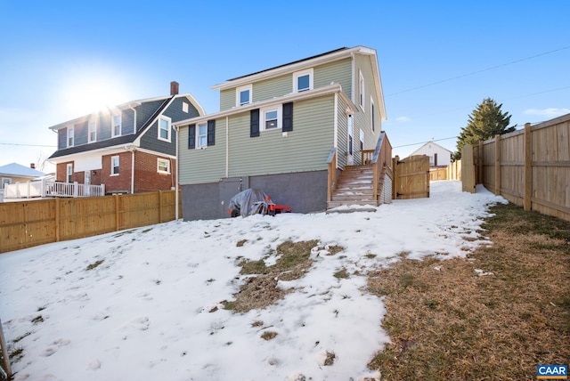 view of snow covered house