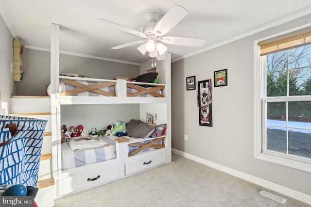 bedroom with ceiling fan, light colored carpet, and crown molding