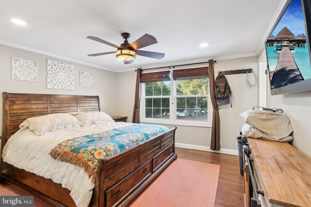 bedroom featuring ceiling fan, crown molding, a textured ceiling, and hardwood / wood-style floors