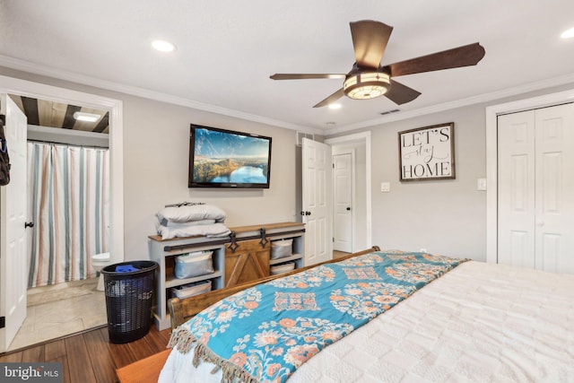 bedroom with ceiling fan, a closet, hardwood / wood-style flooring, and crown molding