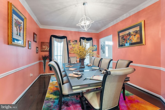 dining area featuring crown molding, hardwood / wood-style flooring, and a notable chandelier