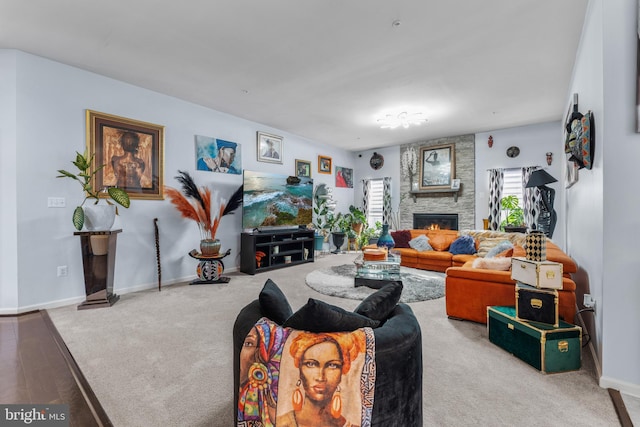 carpeted living room with a fireplace