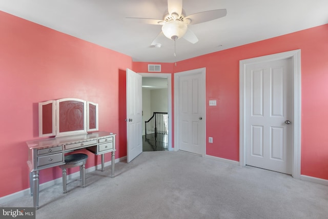 bedroom with light carpet and ceiling fan