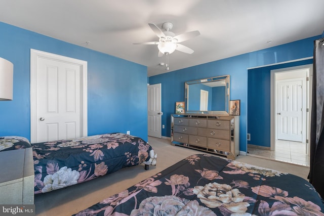 bedroom featuring ceiling fan and light colored carpet