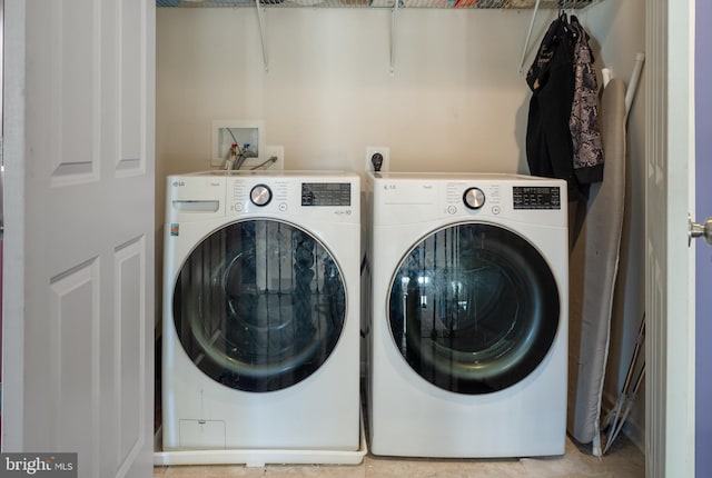 washroom featuring washer and dryer