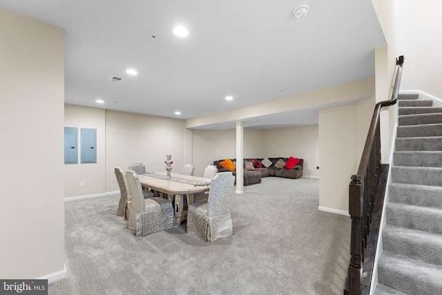 carpeted dining space with electric panel