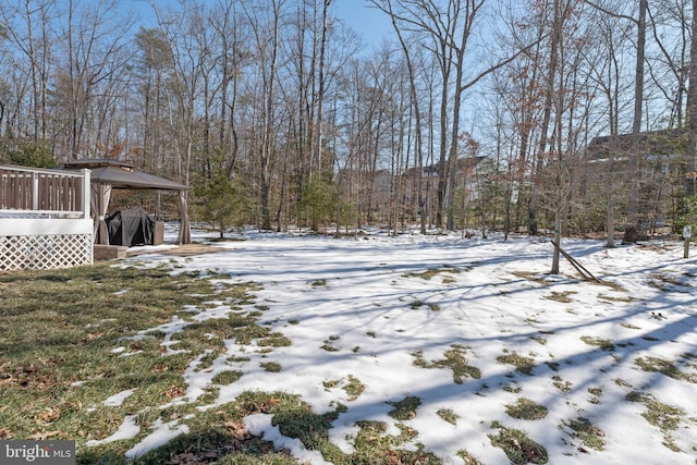 snowy yard with a gazebo