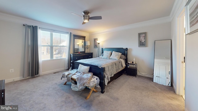 bedroom featuring light carpet, crown molding, and ceiling fan