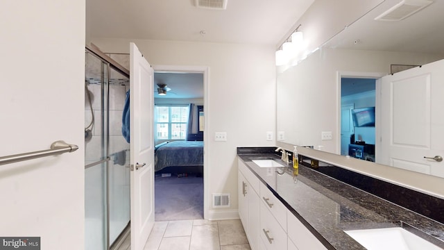 bathroom featuring vanity, tile patterned floors, ceiling fan, and walk in shower