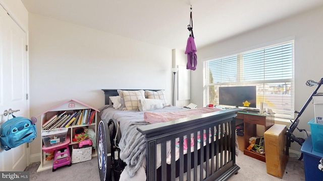 bedroom featuring light colored carpet