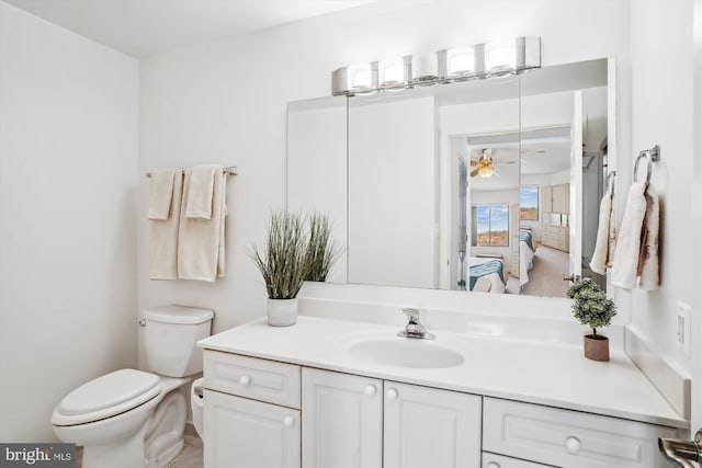 ensuite bathroom featuring toilet, vanity, and ensuite bathroom