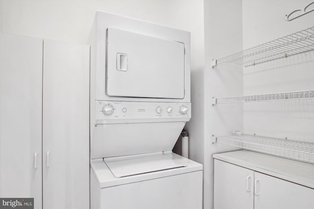 laundry area with laundry area and stacked washing maching and dryer