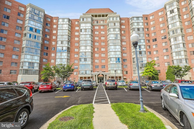 view of property with uncovered parking