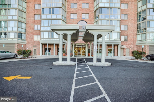 property entrance featuring brick siding