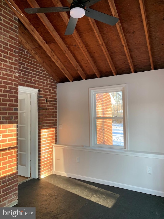 interior space featuring vaulted ceiling with beams, wooden ceiling, brick wall, and a ceiling fan