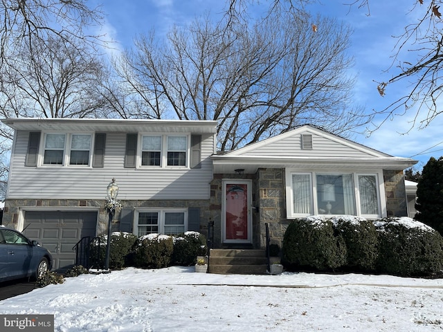 split level home featuring a garage