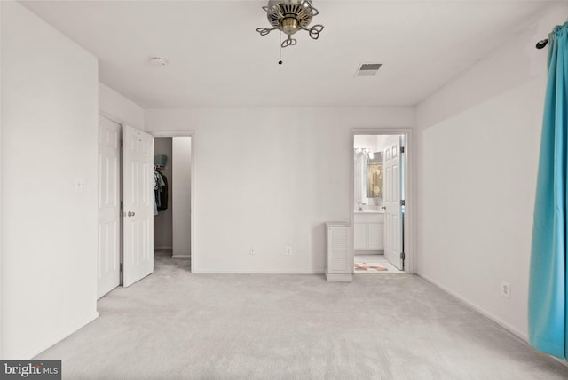 unfurnished room with sink and light carpet