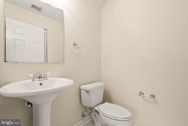 bathroom featuring sink and toilet