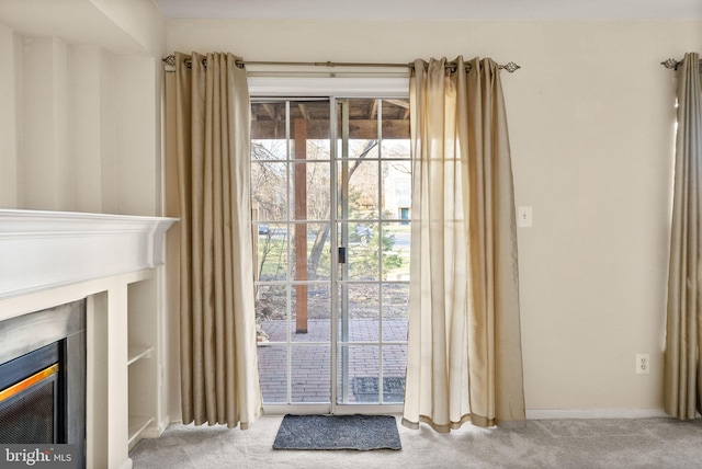 doorway featuring light carpet