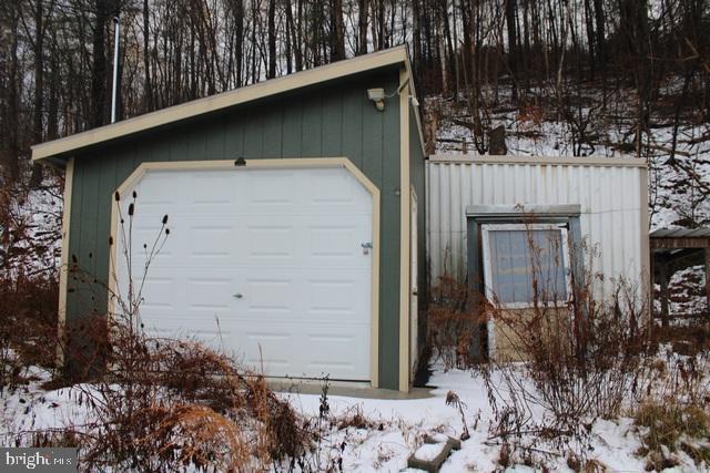 view of snow covered garage