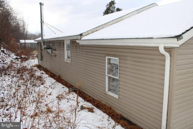 view of snow covered property