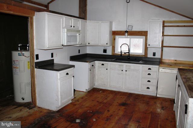 kitchen with white cabinets, white appliances, electric water heater, and sink