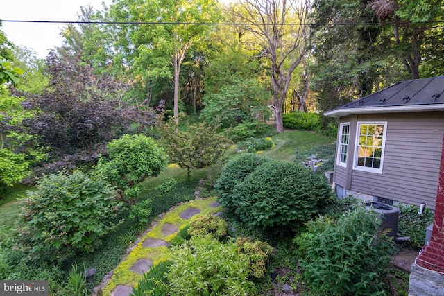 view of yard featuring central AC