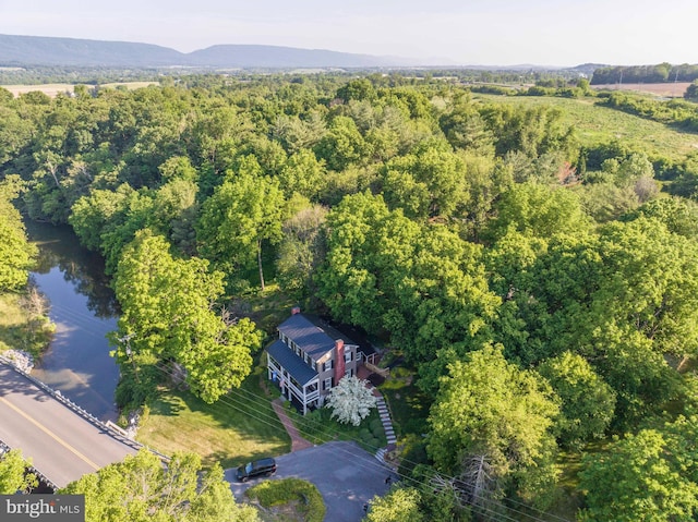 drone / aerial view with a water and mountain view