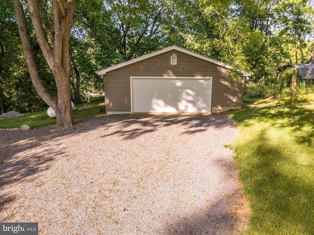 garage featuring a lawn