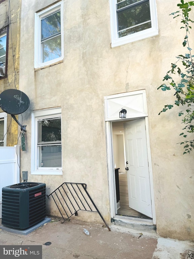 doorway to property with central AC unit