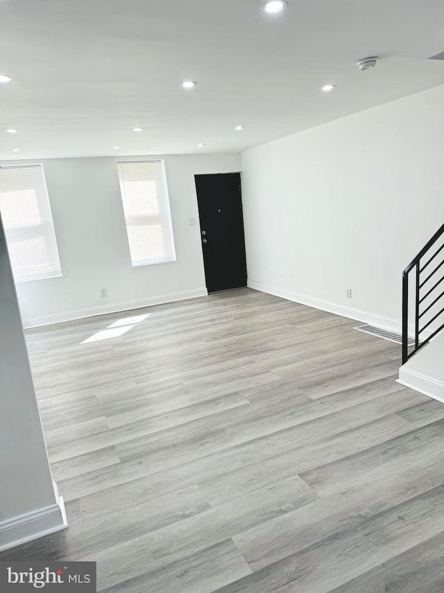 unfurnished room featuring light hardwood / wood-style floors