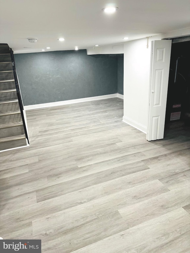 basement featuring light wood-type flooring