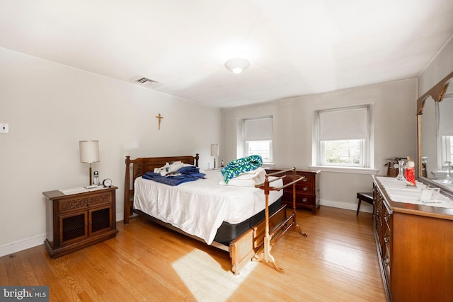 bedroom featuring light hardwood / wood-style floors