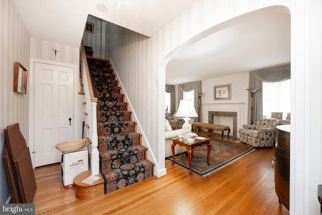 staircase with hardwood / wood-style flooring