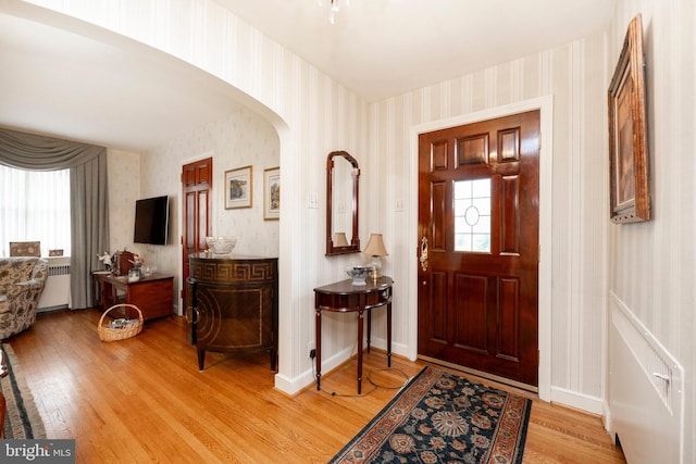 entrance foyer featuring a healthy amount of sunlight and light hardwood / wood-style flooring