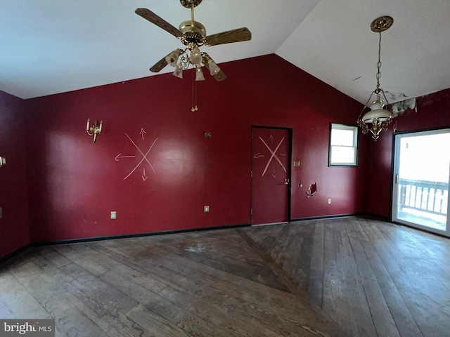 empty room with hardwood / wood-style flooring, lofted ceiling, and ceiling fan