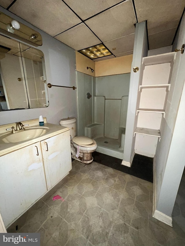 bathroom with walk in shower, vanity, and toilet