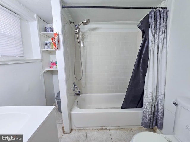 bathroom with toilet, shower / tub combo, and tile patterned flooring