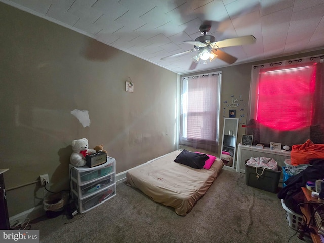 bedroom featuring ceiling fan and carpet flooring