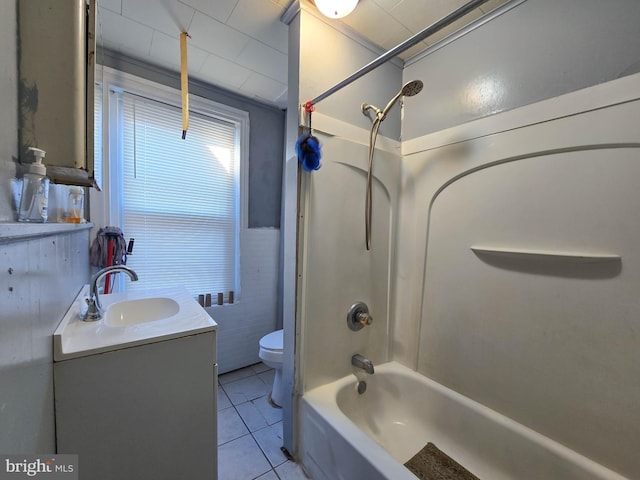 full bathroom with tile patterned floors, vanity, shower / bath combination, toilet, and tile walls