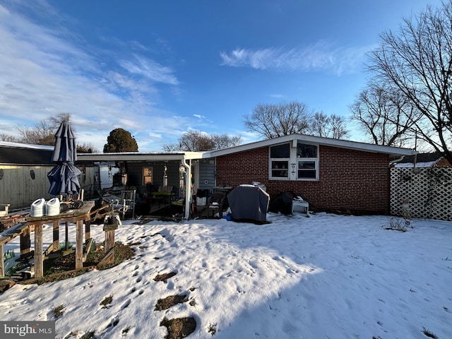 view of snow covered house