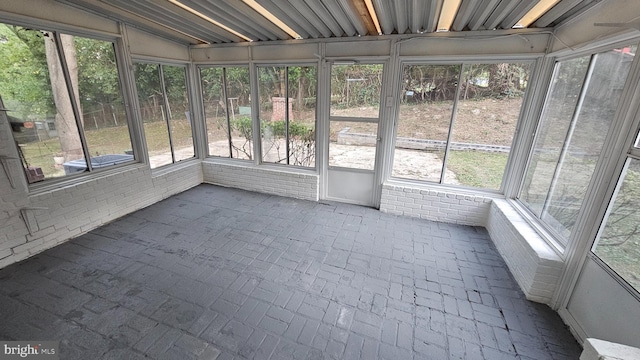 unfurnished sunroom with a wealth of natural light