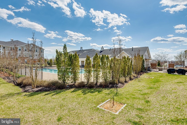 view of yard with a community pool