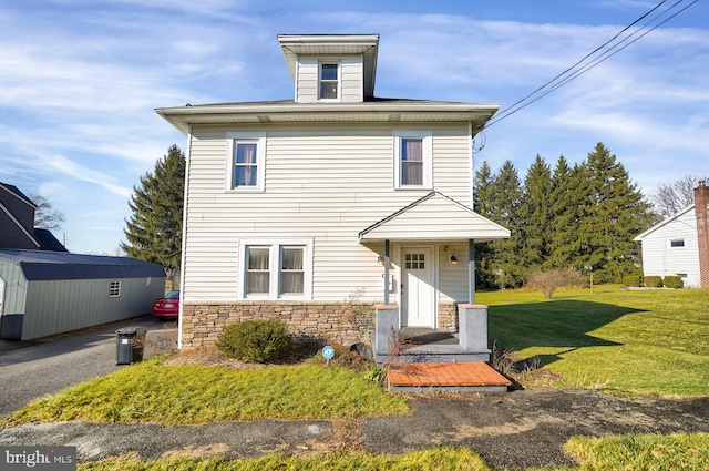 front facade with a front yard