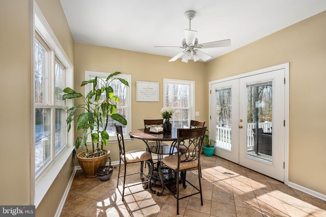 sunroom / solarium featuring ceiling fan and french doors