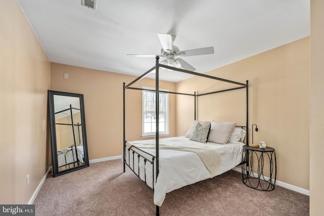 bedroom featuring ceiling fan and carpet