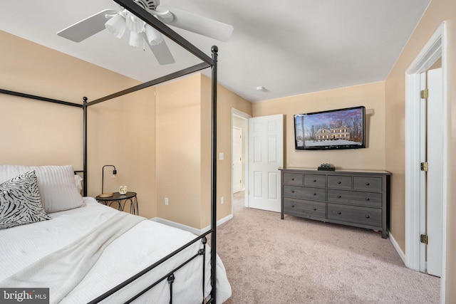 bedroom with ceiling fan and light colored carpet