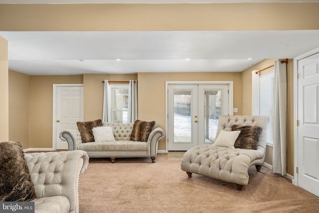 living room featuring french doors and carpet floors