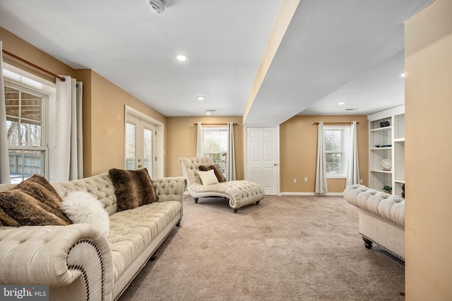 carpeted living room with french doors